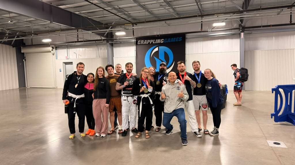 The team together at a jiu-jitsu tournament